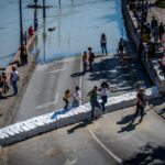 Danube waters reach parliament’s steps as Storm Boris floods Hungary