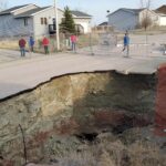 Giant sinkholes in a South Dakota neighborhood make families fear for their safety