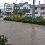 Japan orders thousands to evacuate quake-hit region as rains trigger floods