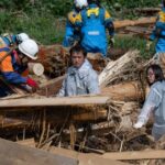 Rescuers comb muddy riverbanks after floods kill six in Japan