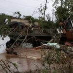 Supplies rushed to communities isolated by Helene as death toll rises to nearly 100