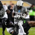 Shedeur Sanders, Travis Hunter help CU beat Cincinnati 34-23 to become bowl eligible