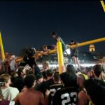 Vandy fans parade goalpost down Broadway, toss it in river