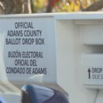 Election workers make sure ballot boxes are secure