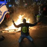 People across Israel protest defence minister’s firing