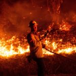 Thousands evacuated as wildfires ravage homes near Los Angeles